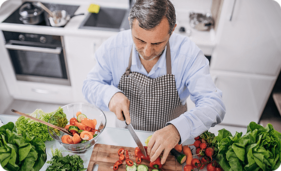 Man chopping vegetables